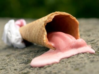 close up shot of melted ice cream on cone